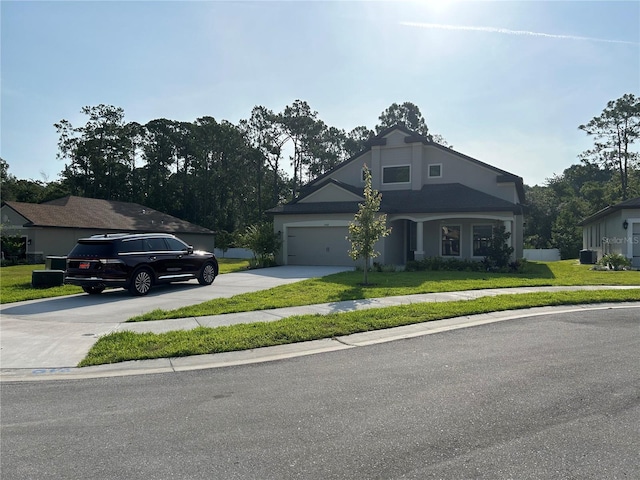 view of front of home featuring a garage and a front lawn