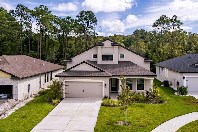 view of front of house with a front yard, a garage, and central air condition unit