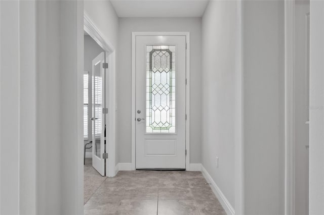 entrance foyer featuring light tile patterned floors