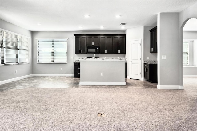 kitchen with a wealth of natural light and a kitchen island