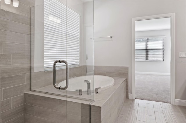 bathroom featuring tiled bath