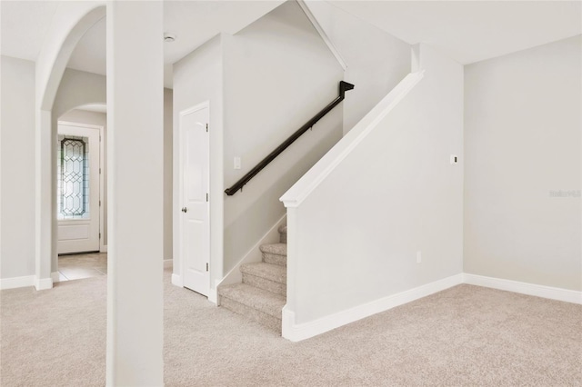 staircase with carpet