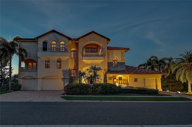 mediterranean / spanish-style home featuring a balcony