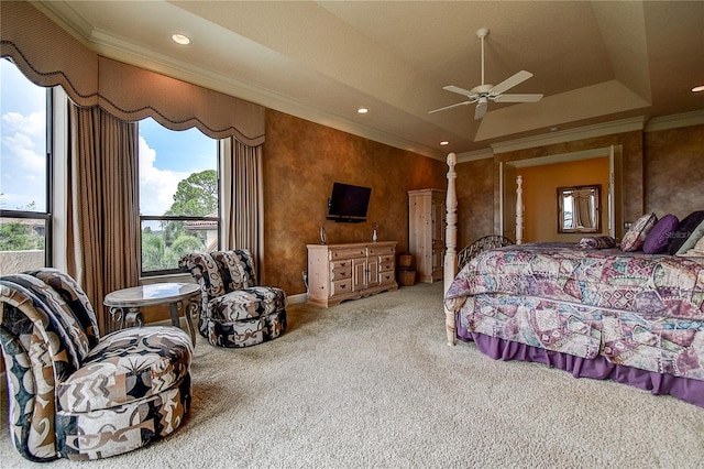 carpeted bedroom featuring crown molding, ceiling fan, lofted ceiling, and a tray ceiling