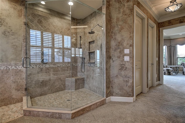 bathroom with crown molding and a shower with shower door