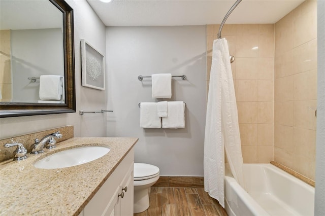 full bathroom with shower / bath combination with curtain, a textured ceiling, oversized vanity, and toilet