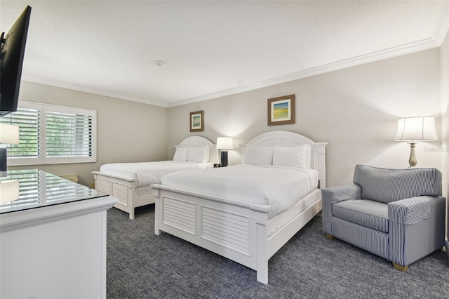 bedroom featuring dark carpet and crown molding