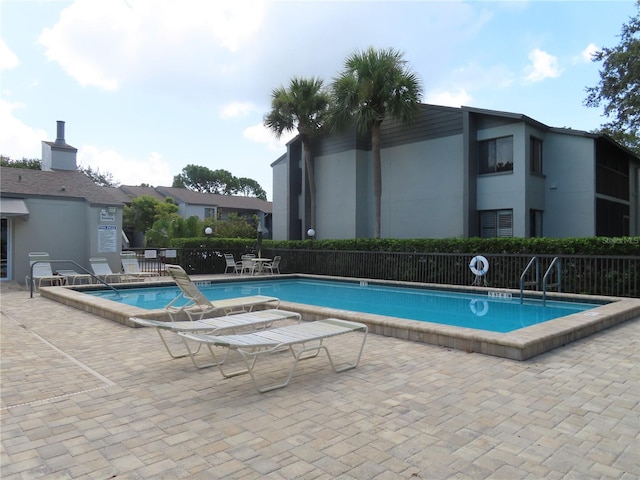 view of swimming pool with a patio area