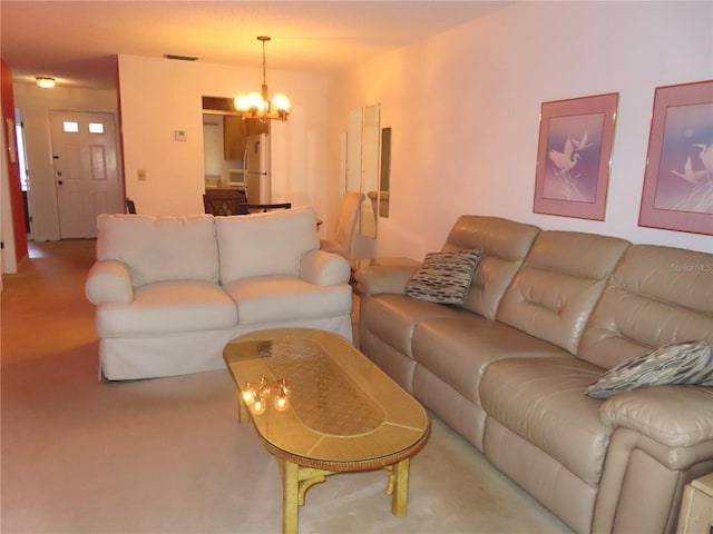 living room with an inviting chandelier