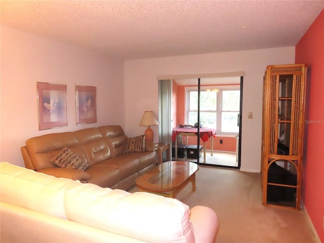 carpeted living room with a textured ceiling