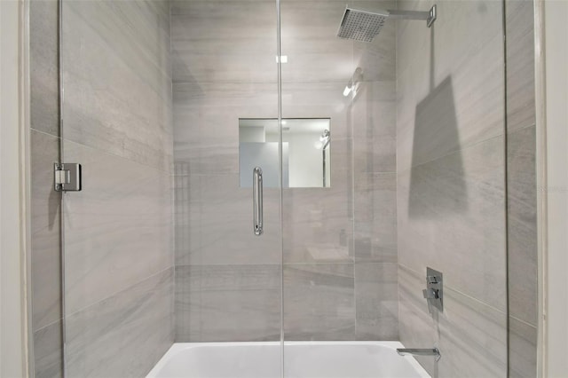 bathroom featuring shower / bath combination with glass door