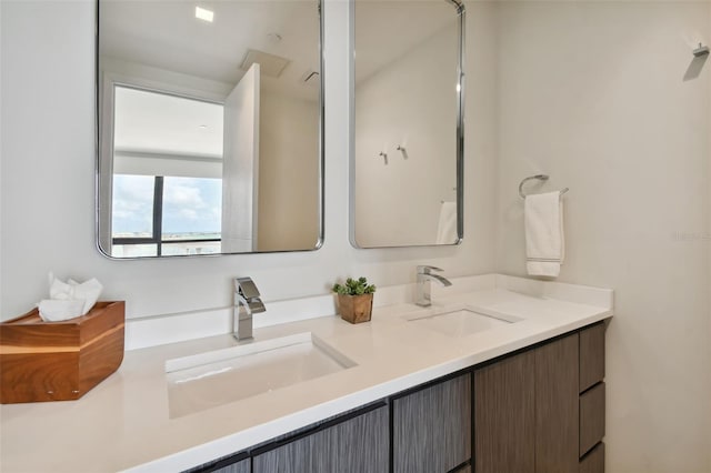 bathroom featuring dual vanity