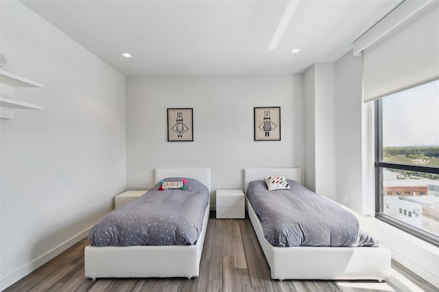 bedroom featuring dark hardwood / wood-style flooring