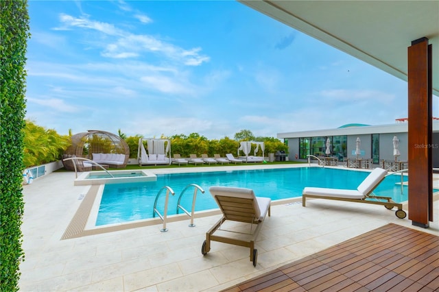 view of swimming pool with a patio