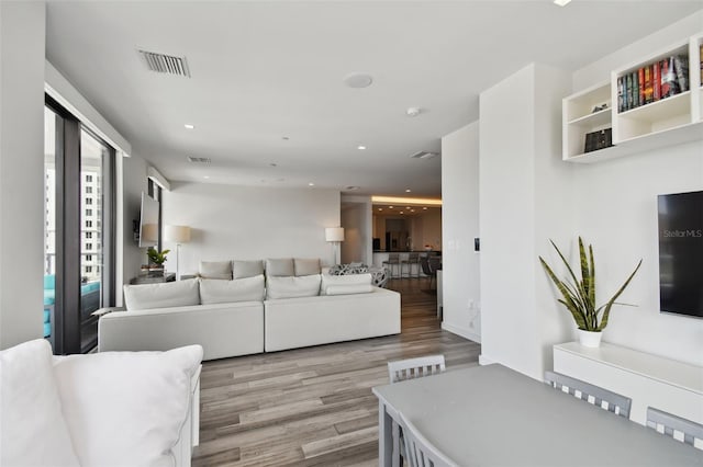 living room with light hardwood / wood-style floors