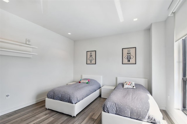 bedroom with dark hardwood / wood-style flooring