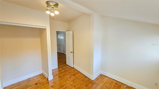 hallway with light hardwood / wood-style floors