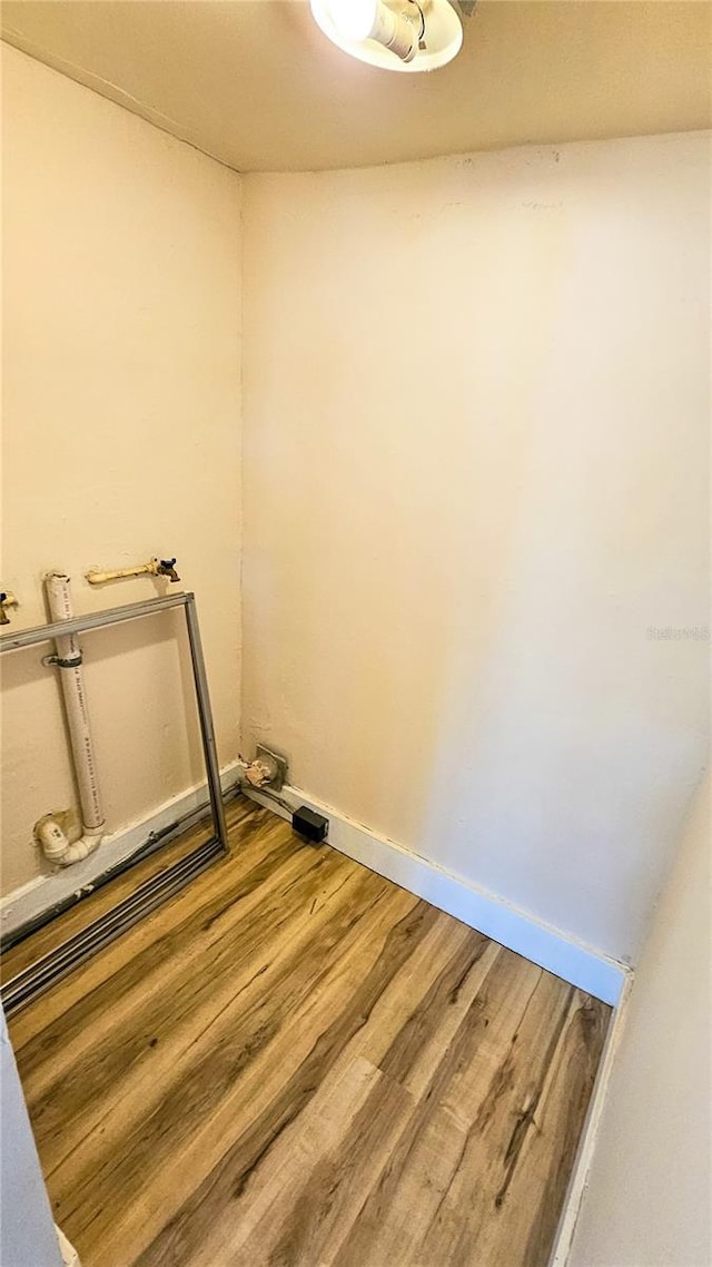 laundry area featuring hardwood / wood-style flooring