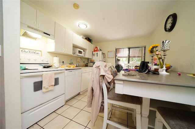 kitchen with white cabinetry, sink, white appliances, and light tile floors