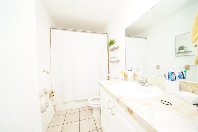 full bathroom featuring tile flooring, toilet, vanity with extensive cabinet space, and shower / bath combo with shower curtain