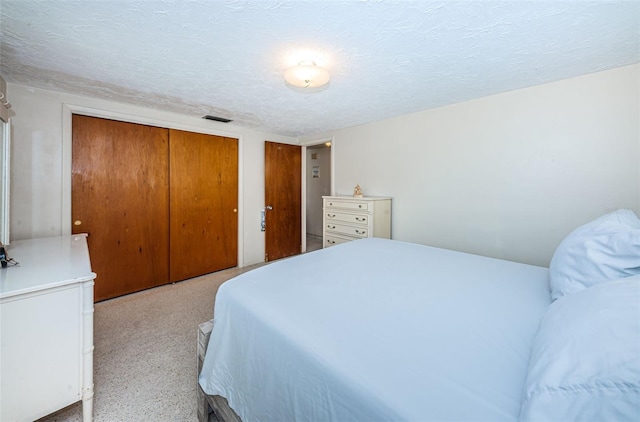 bedroom featuring a textured ceiling