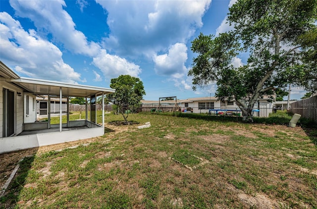 view of yard featuring a sunroom