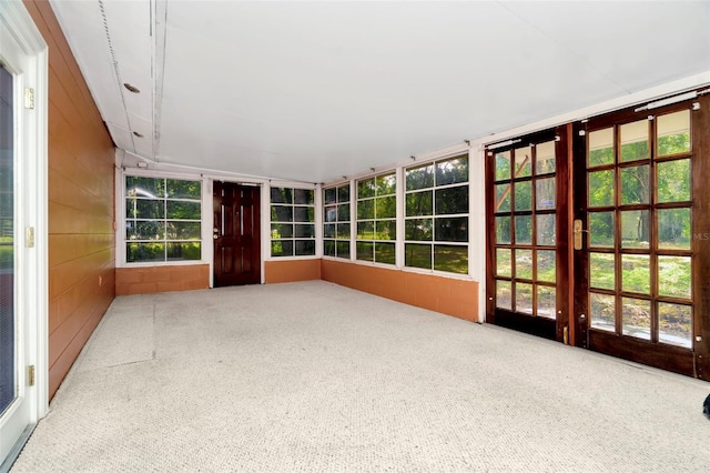 unfurnished sunroom featuring french doors