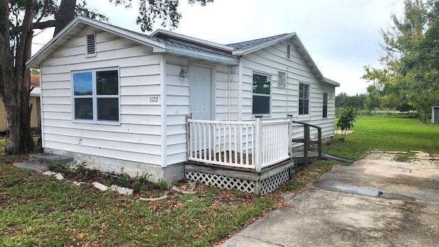 view of home's exterior with a yard