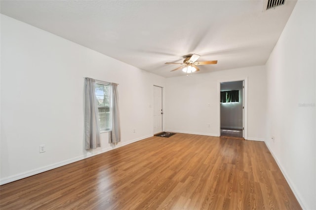 unfurnished room featuring hardwood / wood-style flooring and ceiling fan