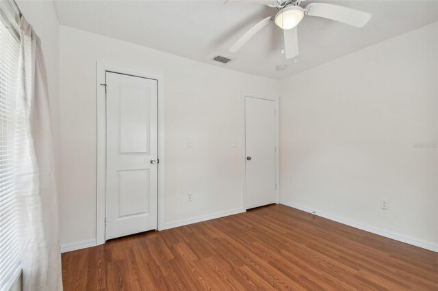 unfurnished bedroom with wood-type flooring and ceiling fan