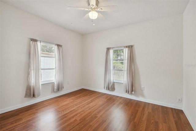 empty room featuring hardwood / wood-style flooring and ceiling fan