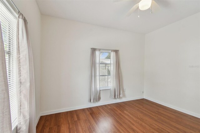 spare room featuring ceiling fan and hardwood / wood-style flooring