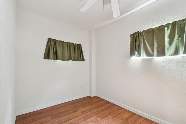 spare room featuring ceiling fan and hardwood / wood-style floors