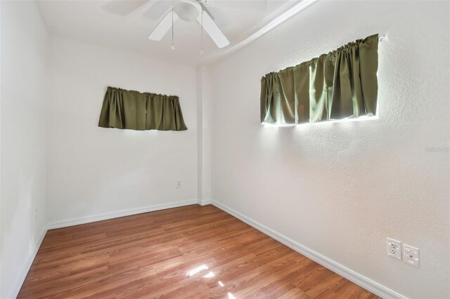 spare room featuring ceiling fan and wood-type flooring