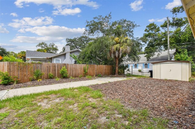 view of yard with a storage shed