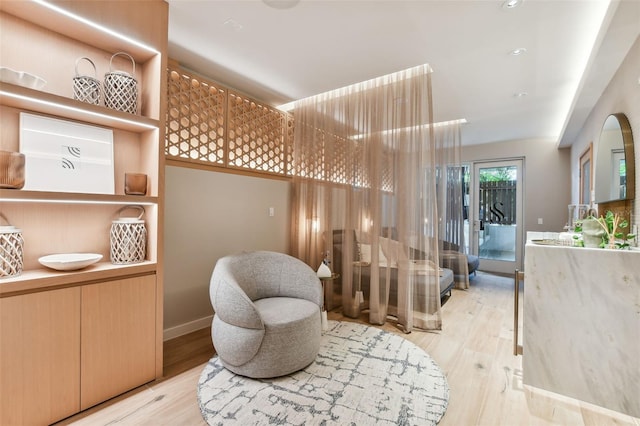 sitting room with light hardwood / wood-style flooring