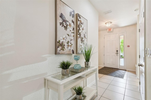 entrance foyer featuring light tile patterned floors