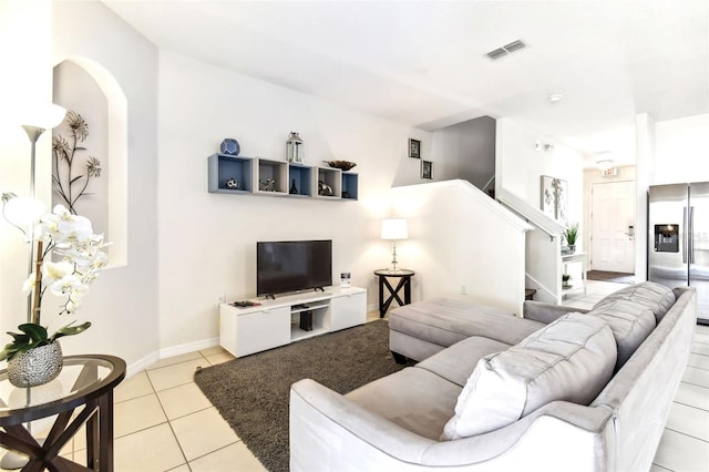 living room with light tile patterned flooring