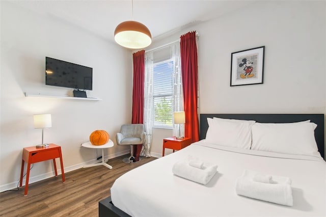 bedroom featuring dark wood-type flooring