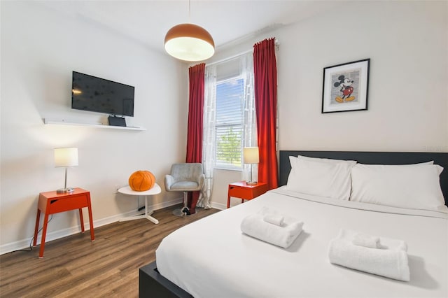 bedroom featuring dark hardwood / wood-style floors