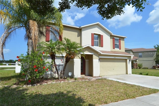 view of front of home featuring a front yard and a garage