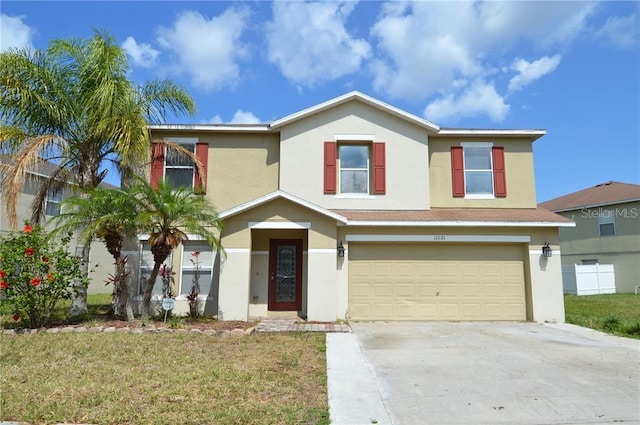 view of front of property with a front lawn and a garage