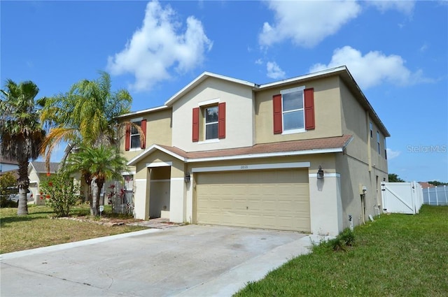 view of front of property with a front yard and a garage