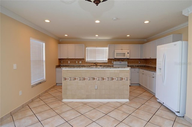 kitchen with a kitchen island, tasteful backsplash, white appliances, and light tile floors