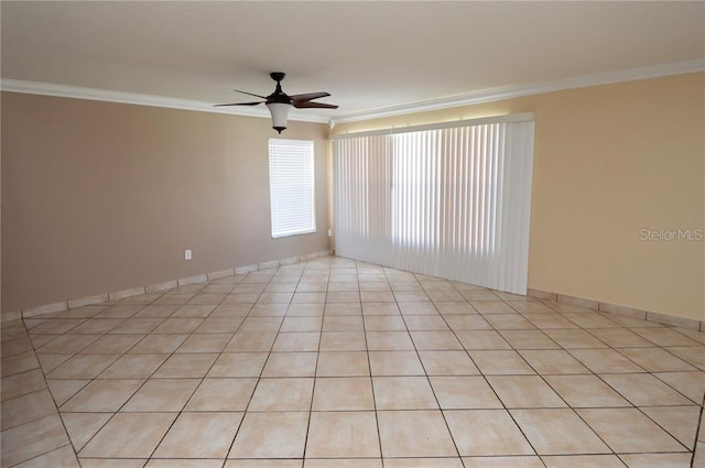 empty room with light tile flooring, ornamental molding, and ceiling fan