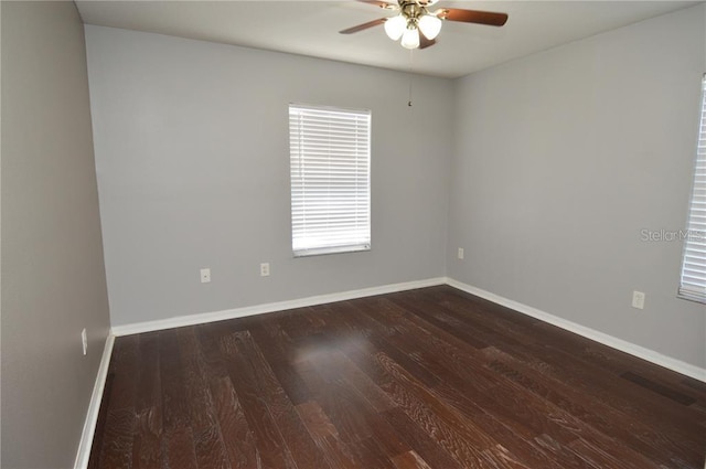 unfurnished room featuring ceiling fan and dark hardwood / wood-style flooring