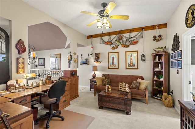 office with beamed ceiling, light carpet, ceiling fan, and a textured ceiling