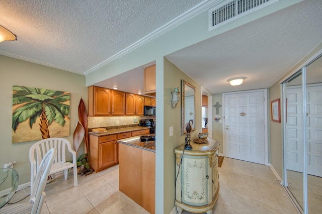 kitchen featuring light tile patterned flooring, ornamental molding, dark stone counters, and decorative backsplash