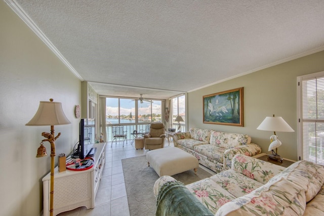 living room with light tile patterned flooring, floor to ceiling windows, crown molding, and a textured ceiling