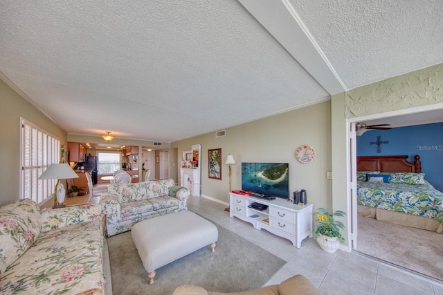 tiled living room with a textured ceiling